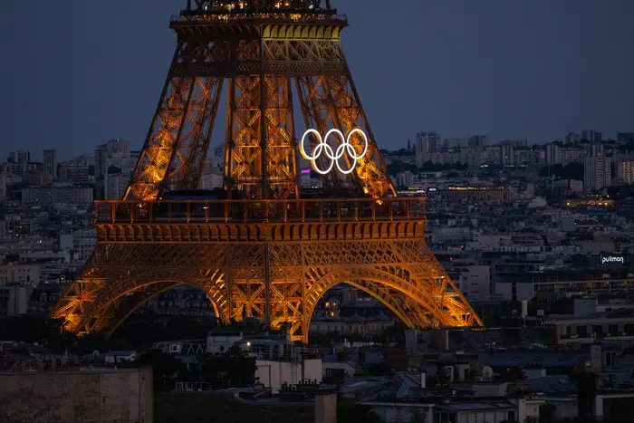 An Eiffel Tower with the Olympics logo on it.